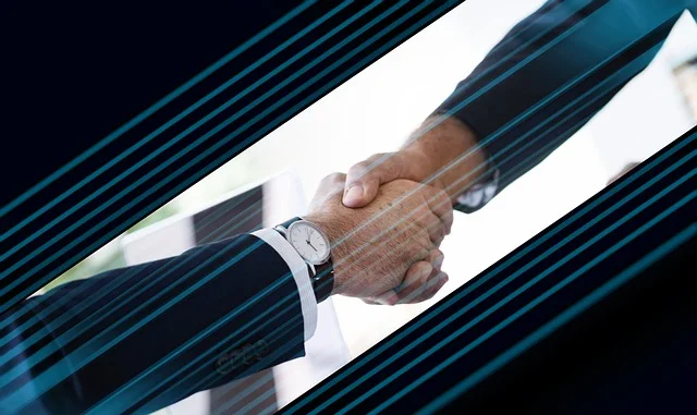 Uścisk dłoni jako symbol partnerstwa biznesowego - odpowiedzialne partnerstwa w łańcuchu dostaw
